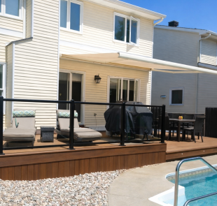 Beautiful Two-Tier Trex Composite Deck in Orleans with Aluminum Glass Rails Overlooking a Pool